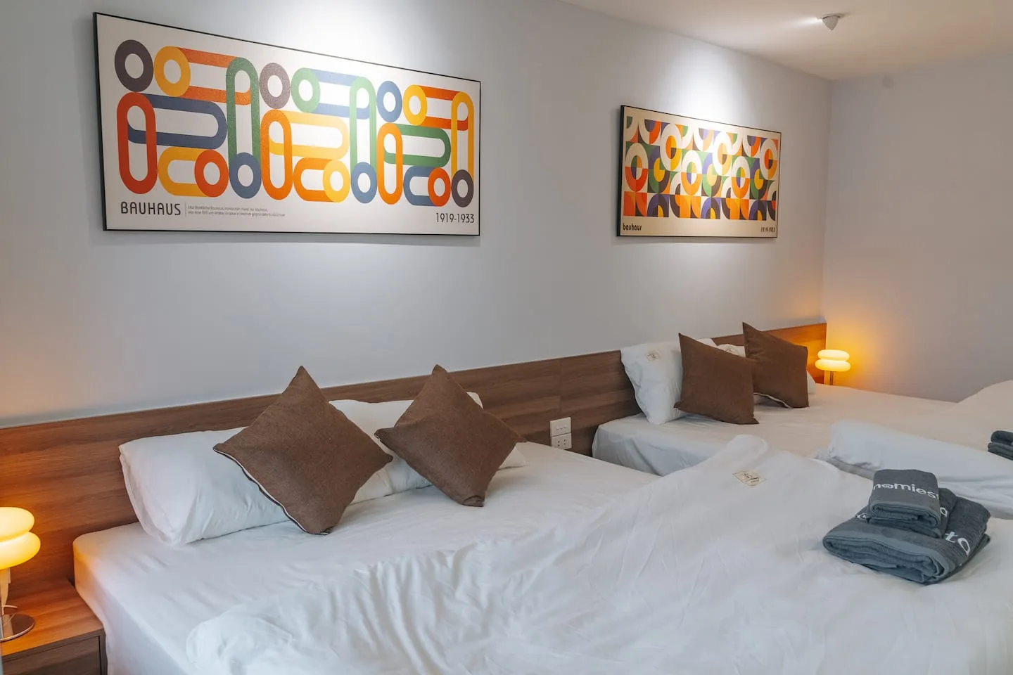 Bedroom 2 with two king beds and Bauhaus-style art