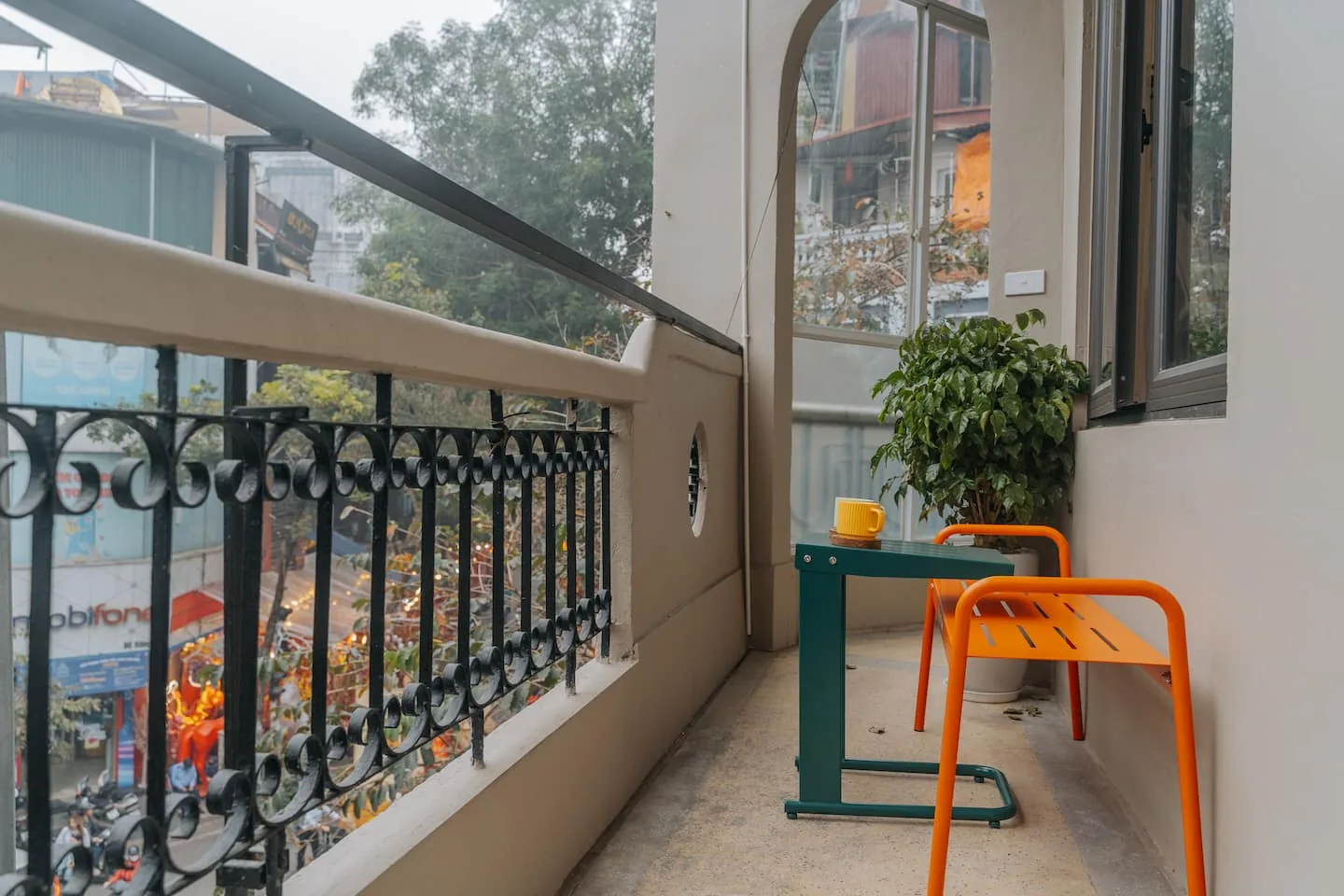 Evening coffee on the HomieStay balcony overlooking Hanoi Old Quarter